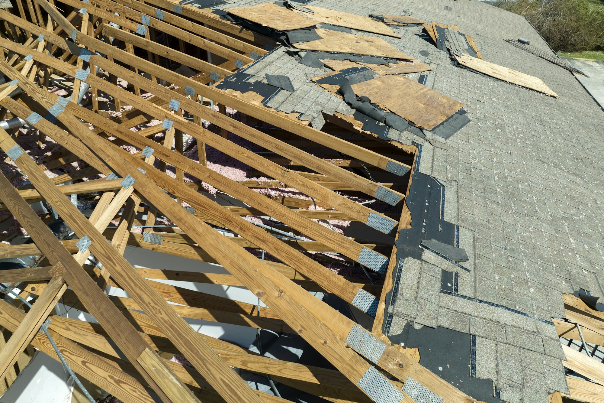 Hurricane Ian destroyed house roof in Florida residential area.