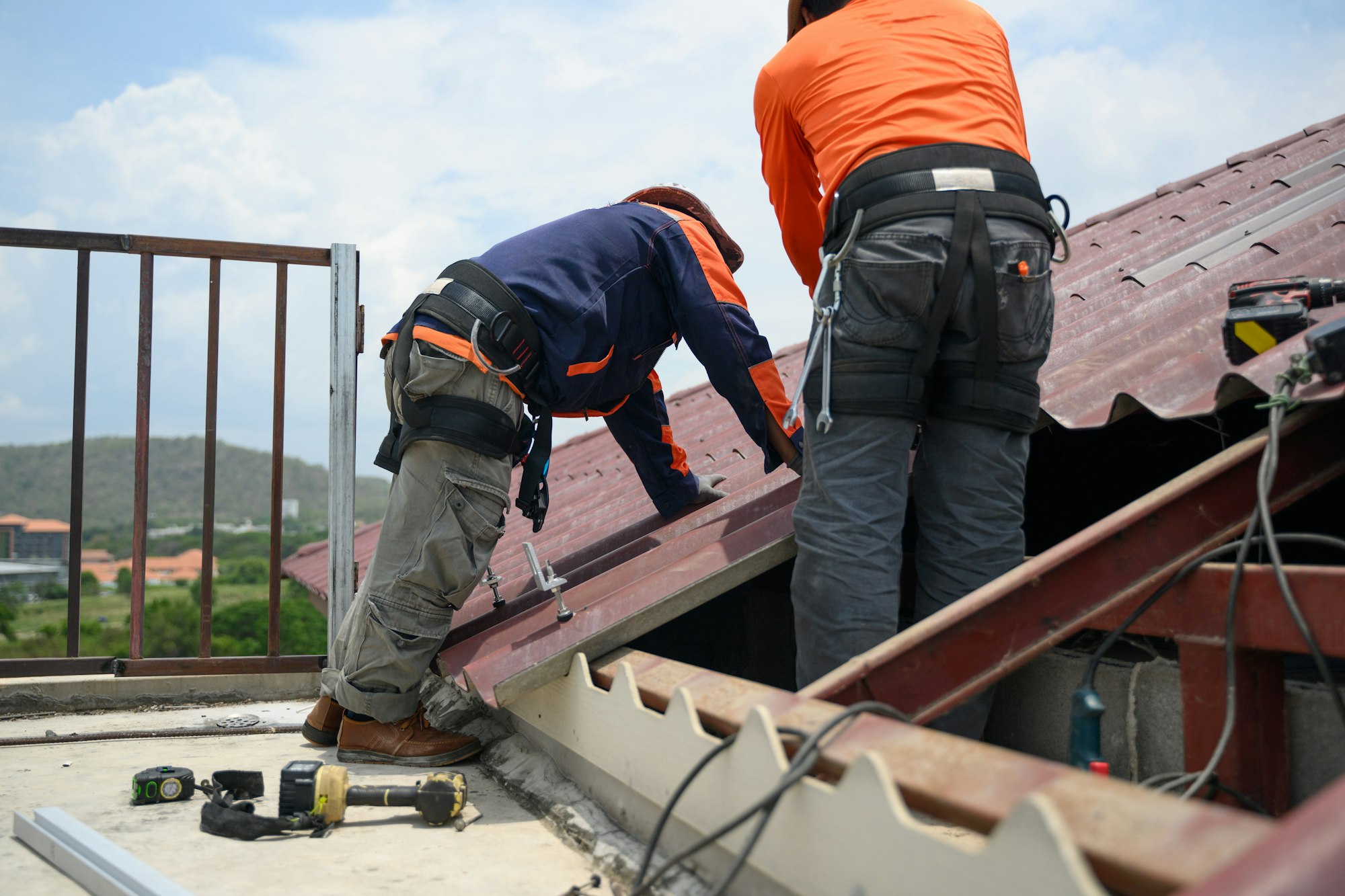 Professional engineer worker installing solar panels system on rooftop